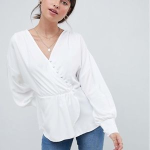 Long sleeve blouse with asymmetric button detail